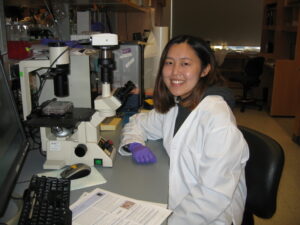 Girl smiling at lab desk